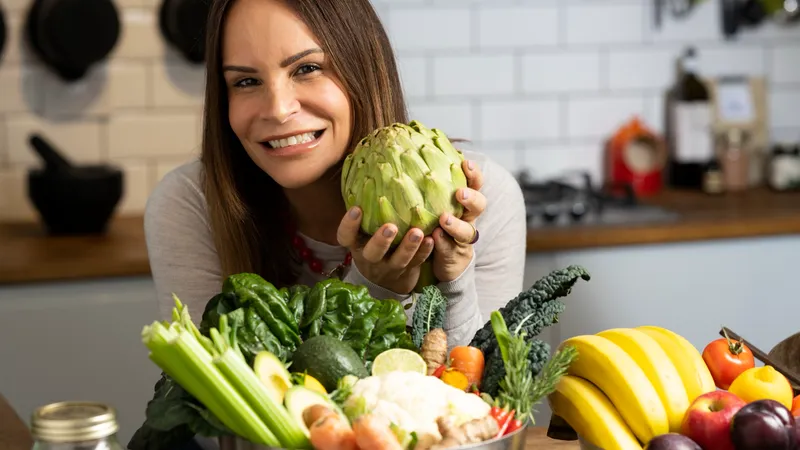 Claudia Ferreira with fresh vegetables, functional nutrition at Body Perfected, Marylebone