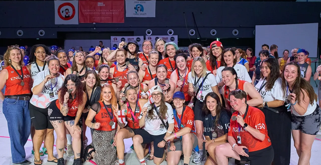 England Women's Roller Derby squad and staff with their medals at the 2025 World Cup in Innsbruck