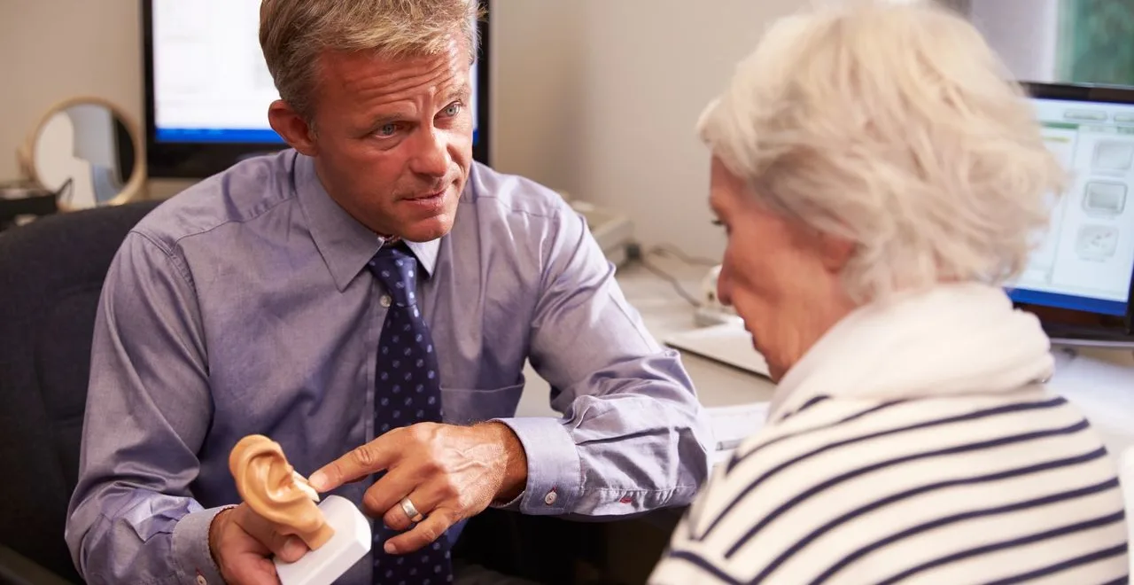 Child taking part in a play audiometry hearing test with an audiologist at Clearly Hearing