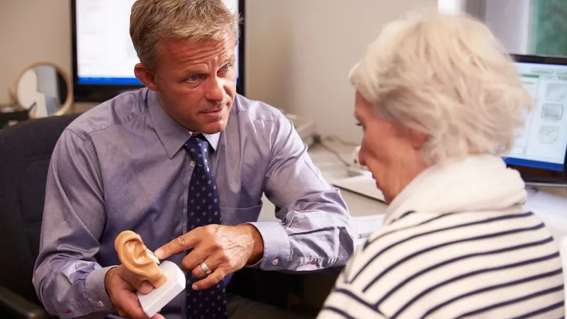Child taking part in a play audiometry hearing test with an audiologist at Clearly Hearing
