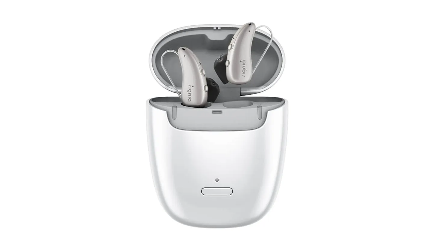 Range of private hearing aids laid out for a fitting appointment in a London audiology clinic