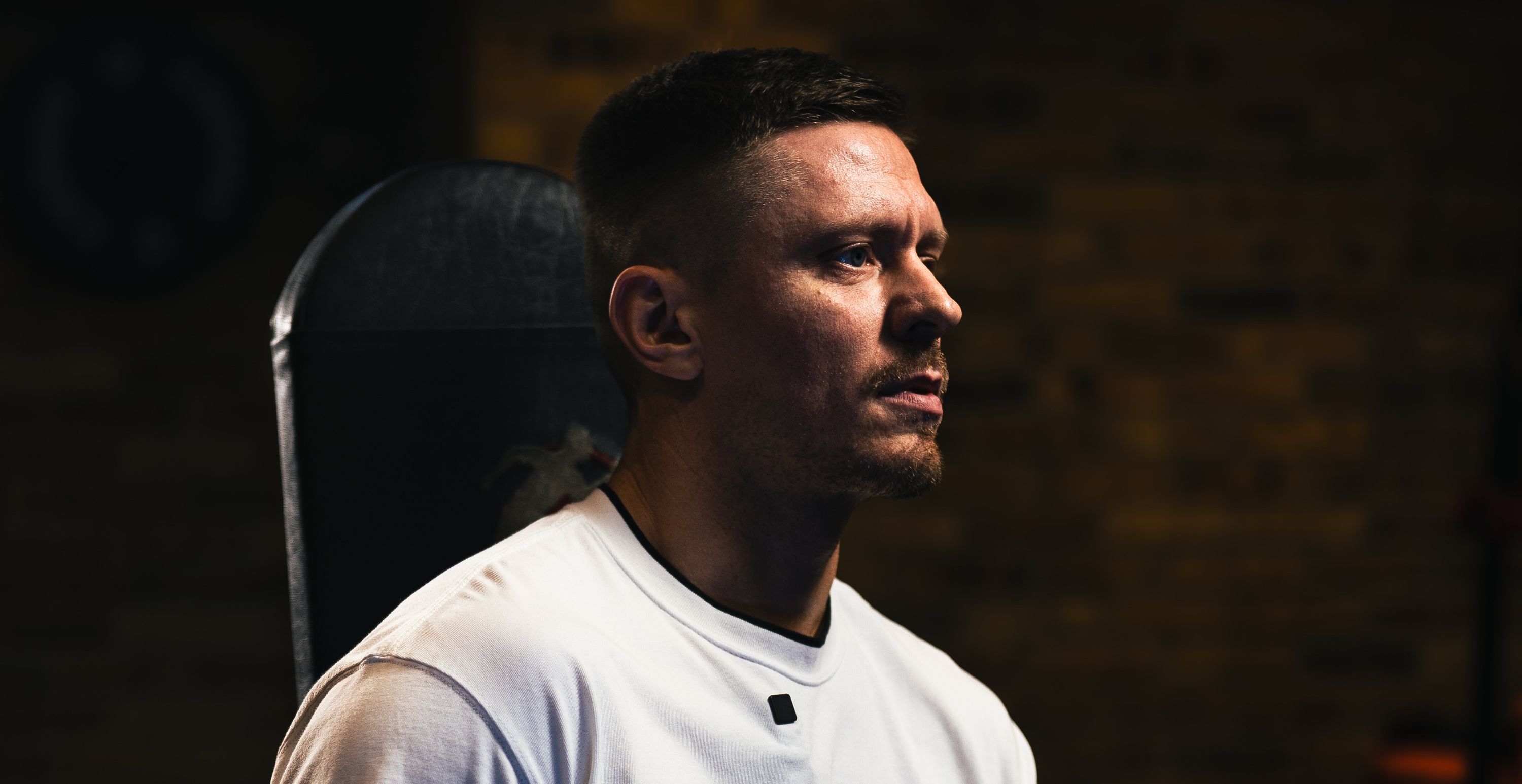 Eugene Churkin of Colossus PT seated on a weight bench between sets