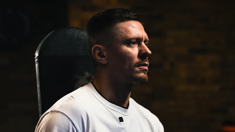 Eugene Churkin of Colossus PT seated on a weight bench between sets