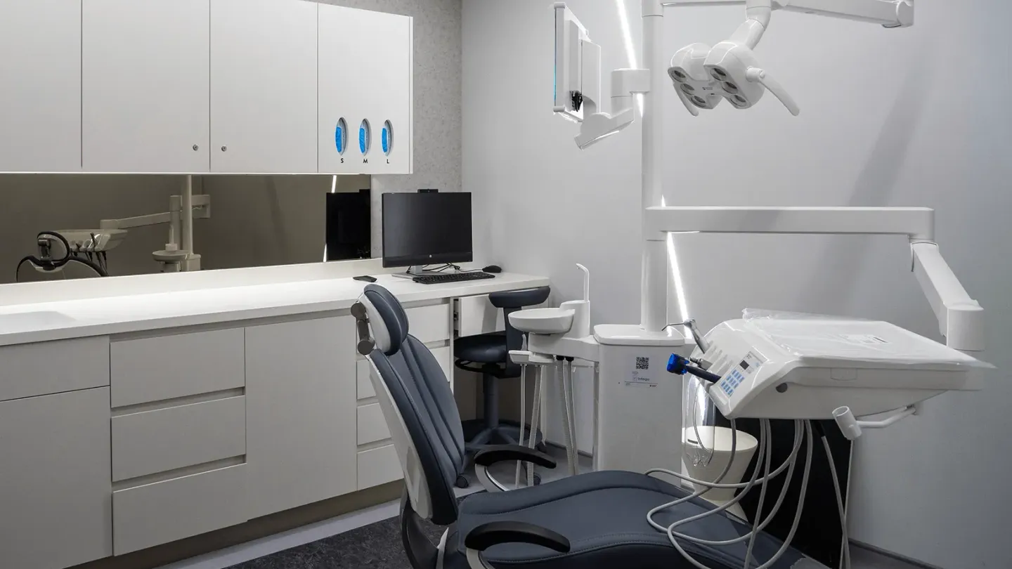 A dental surgery at UNTIL Marylebone, with a Sirona treatment chair, operating light and chairside monitor