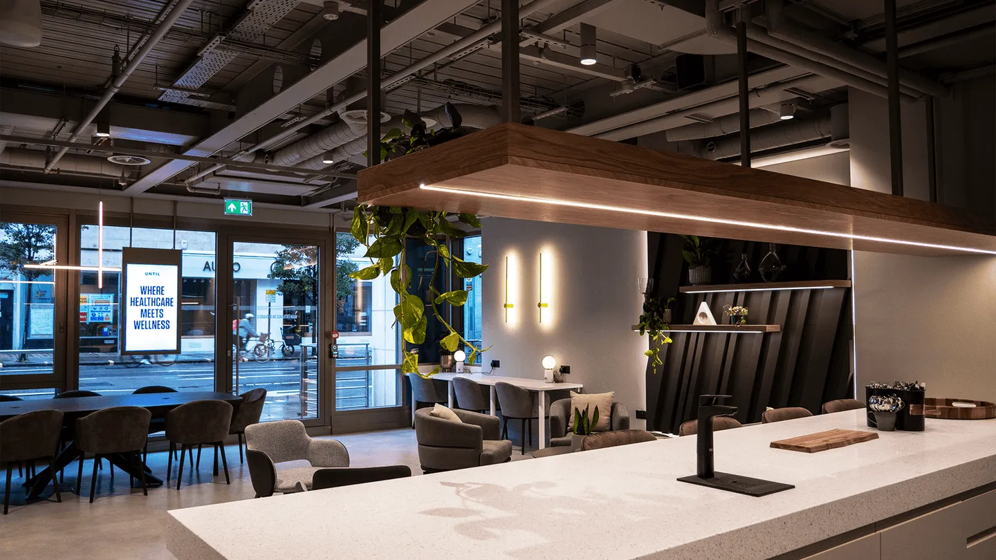 The ground floor kitchen counter at UNTIL Marylebone, with the shopfront glazing onto Orchard Street behind it