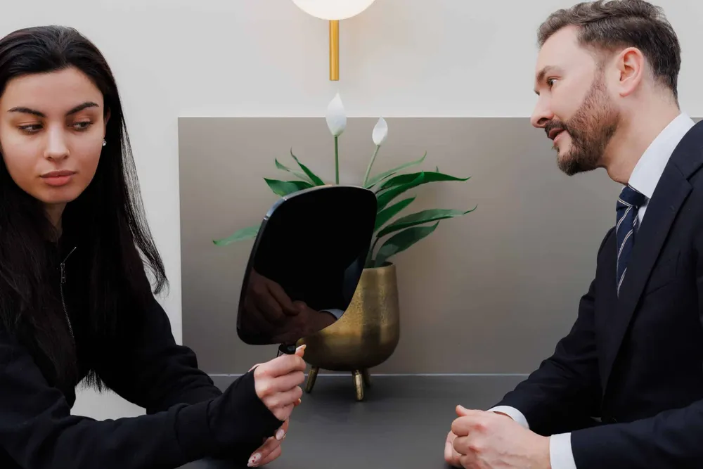 Dr Paul Elgey in consultation with a patient at his Marylebone clinic