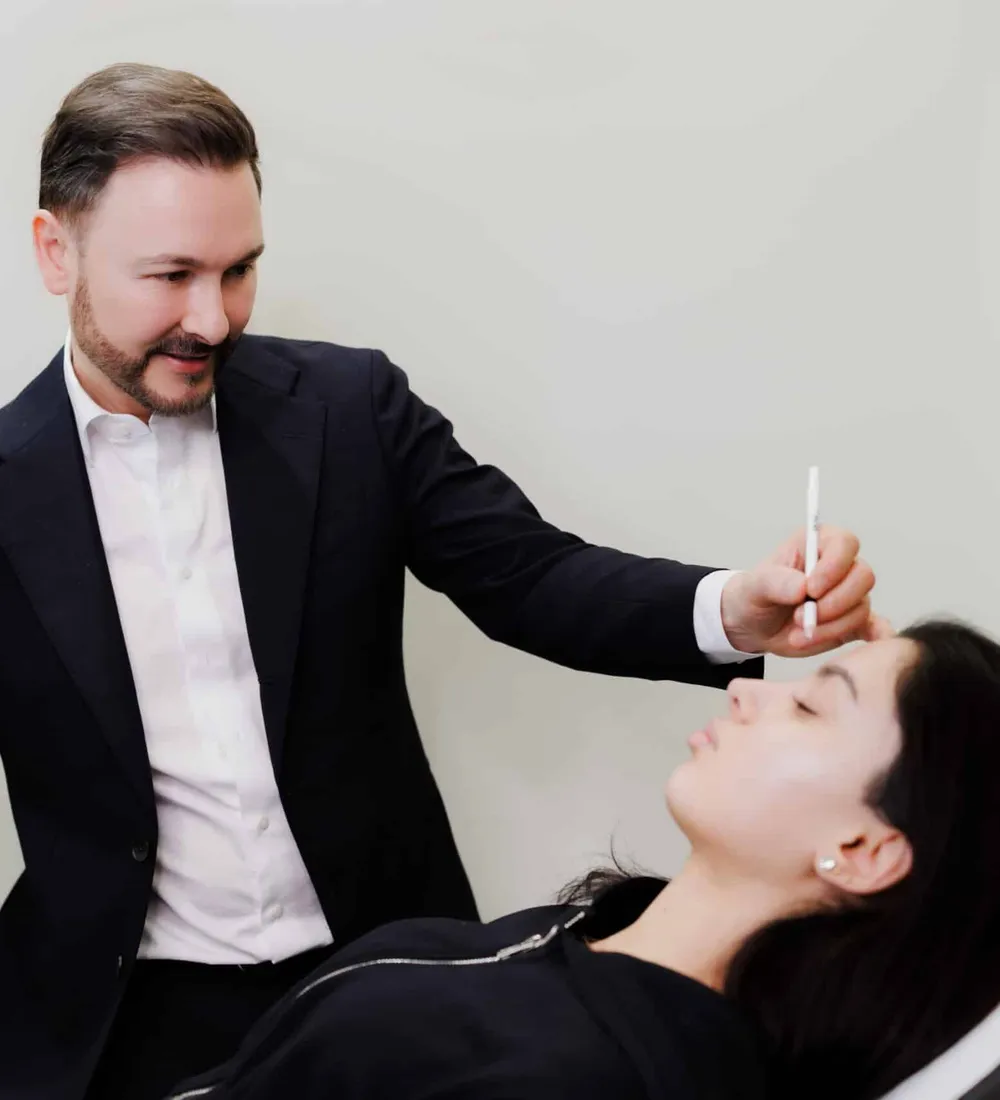 Dr Paul Elgey delivering an injectable treatment