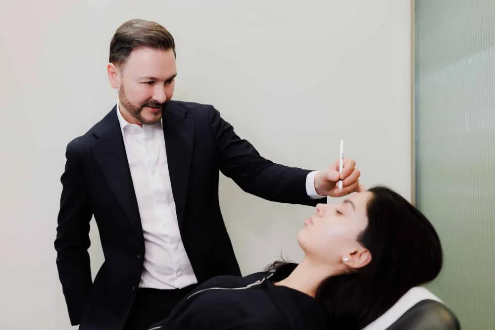 Dr Paul Elgey delivering an injectable treatment at his Marylebone clinic