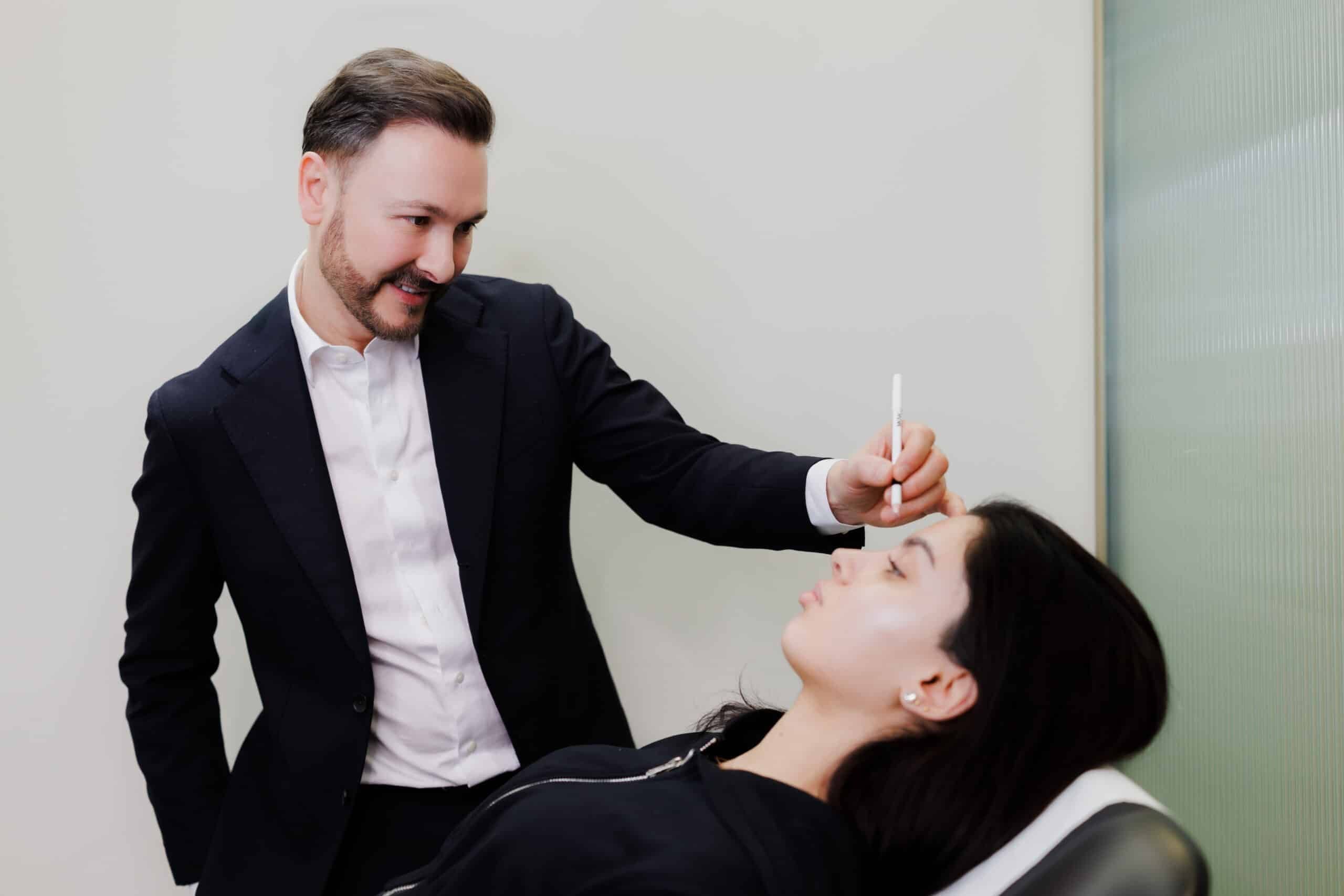 Dr Paul Elgey treating a patient at his Marylebone clinic