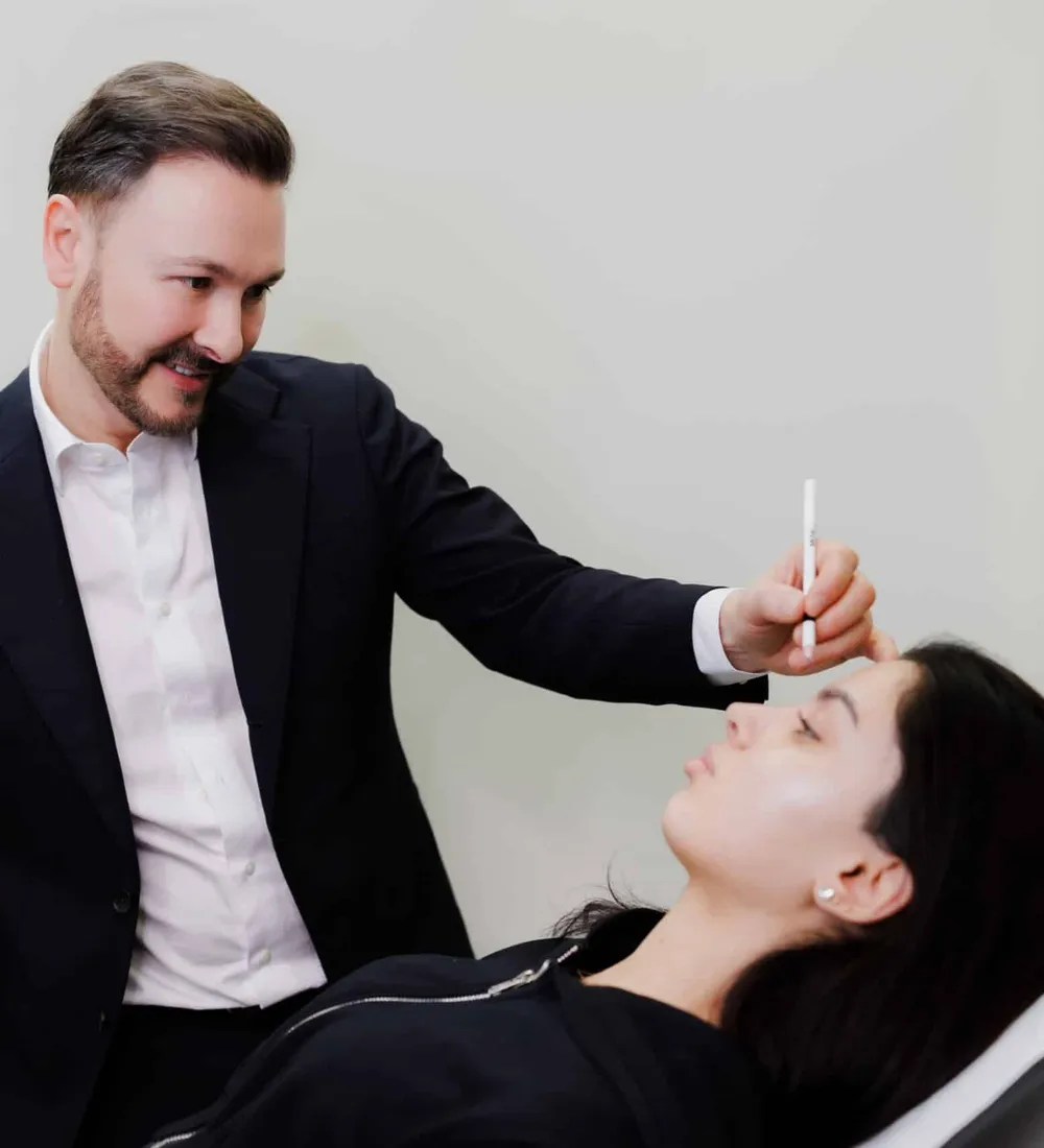 Dr Paul Elgey treating a patient at his Marylebone clinic