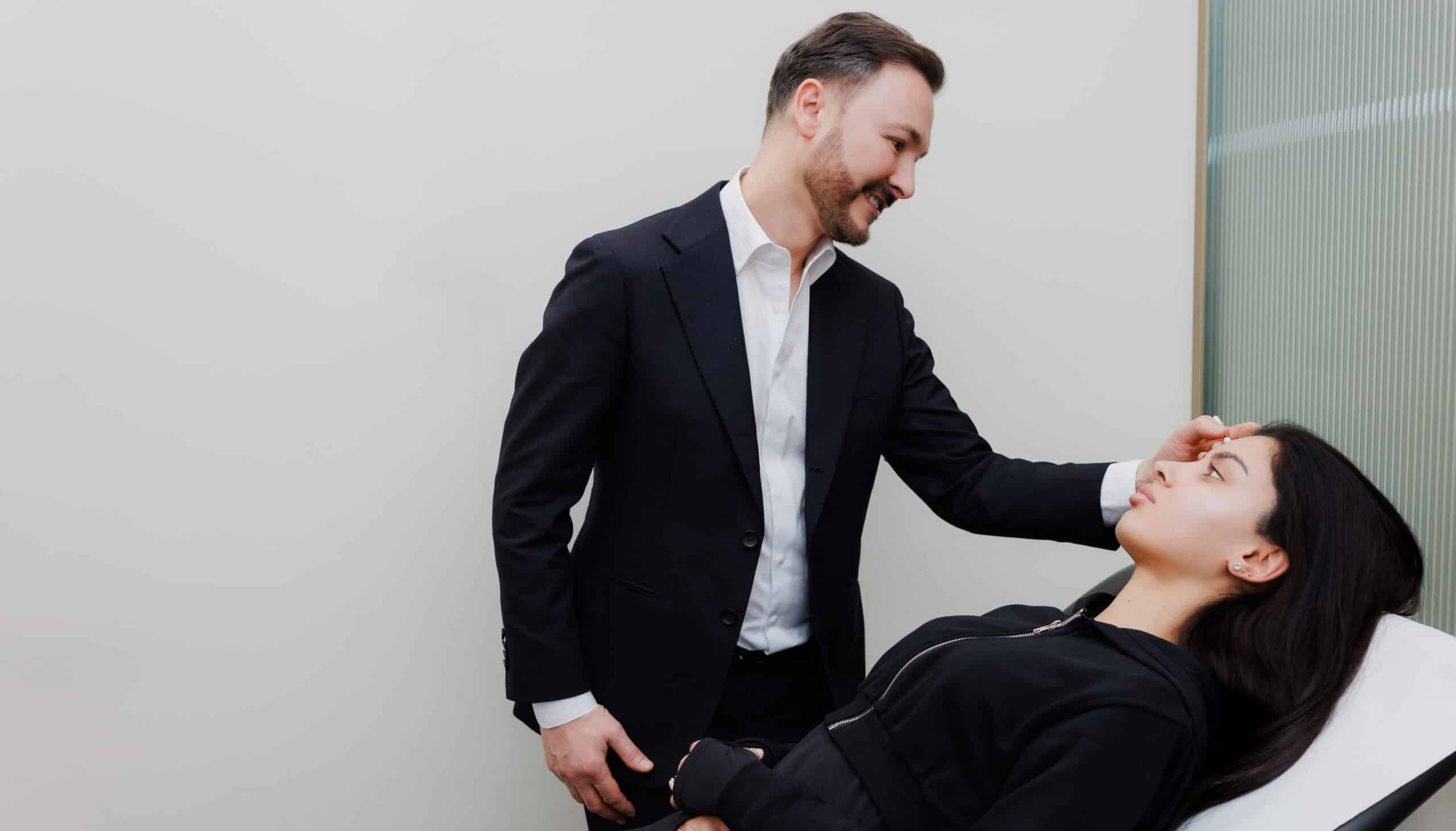 Dr Paul Elgey assessing a patient before treatment