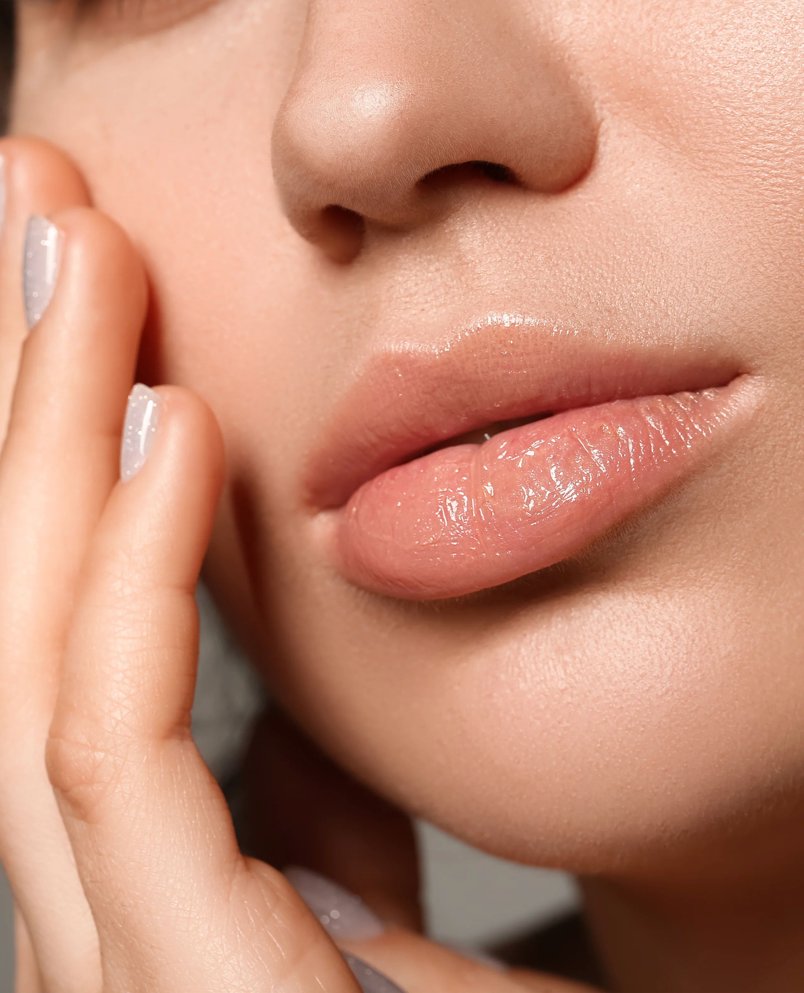 Close detail of a natural lip filler result treated with a micro-cannula