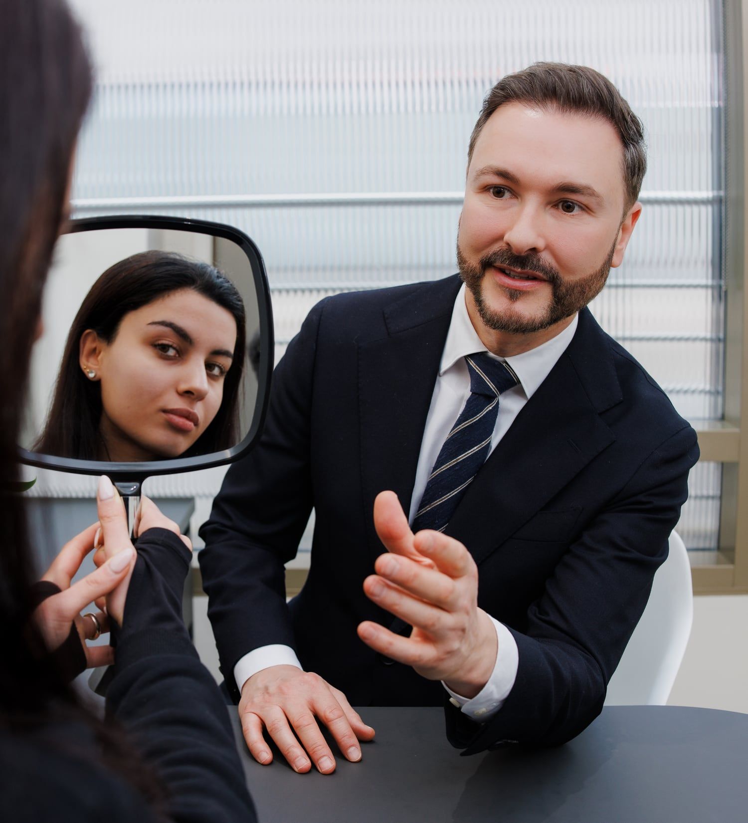 Dr Paul Elgey in consultation with a patient at his Marylebone clinic