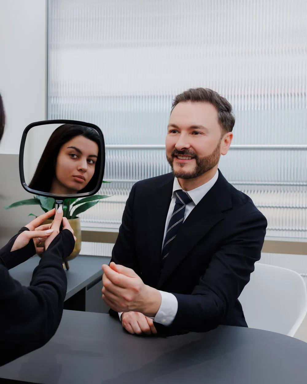 Dr Paul Elgey in consultation with a patient at his Marylebone clinic
