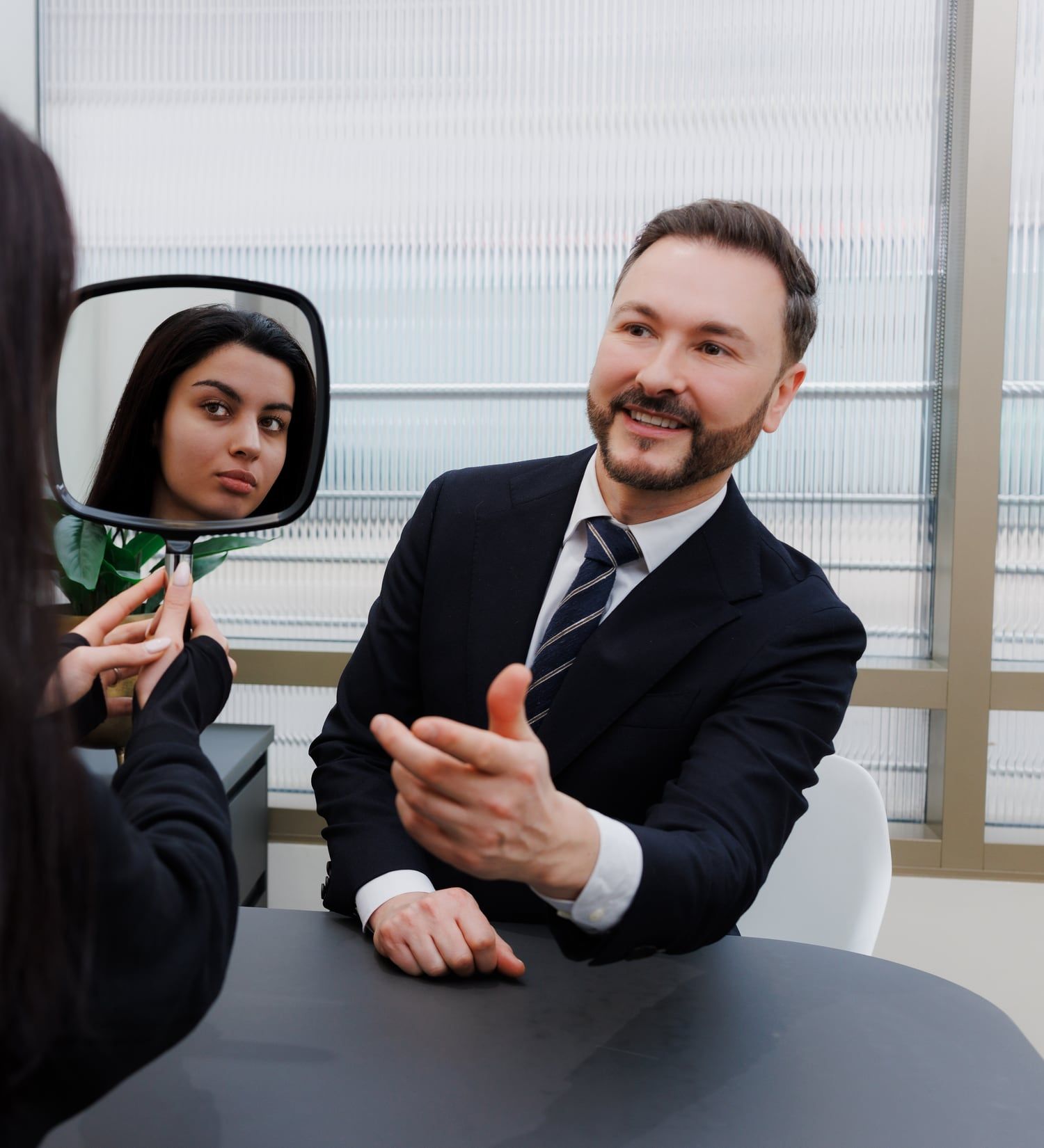 Dr Paul Elgey in consultation with a patient at his Marylebone clinic