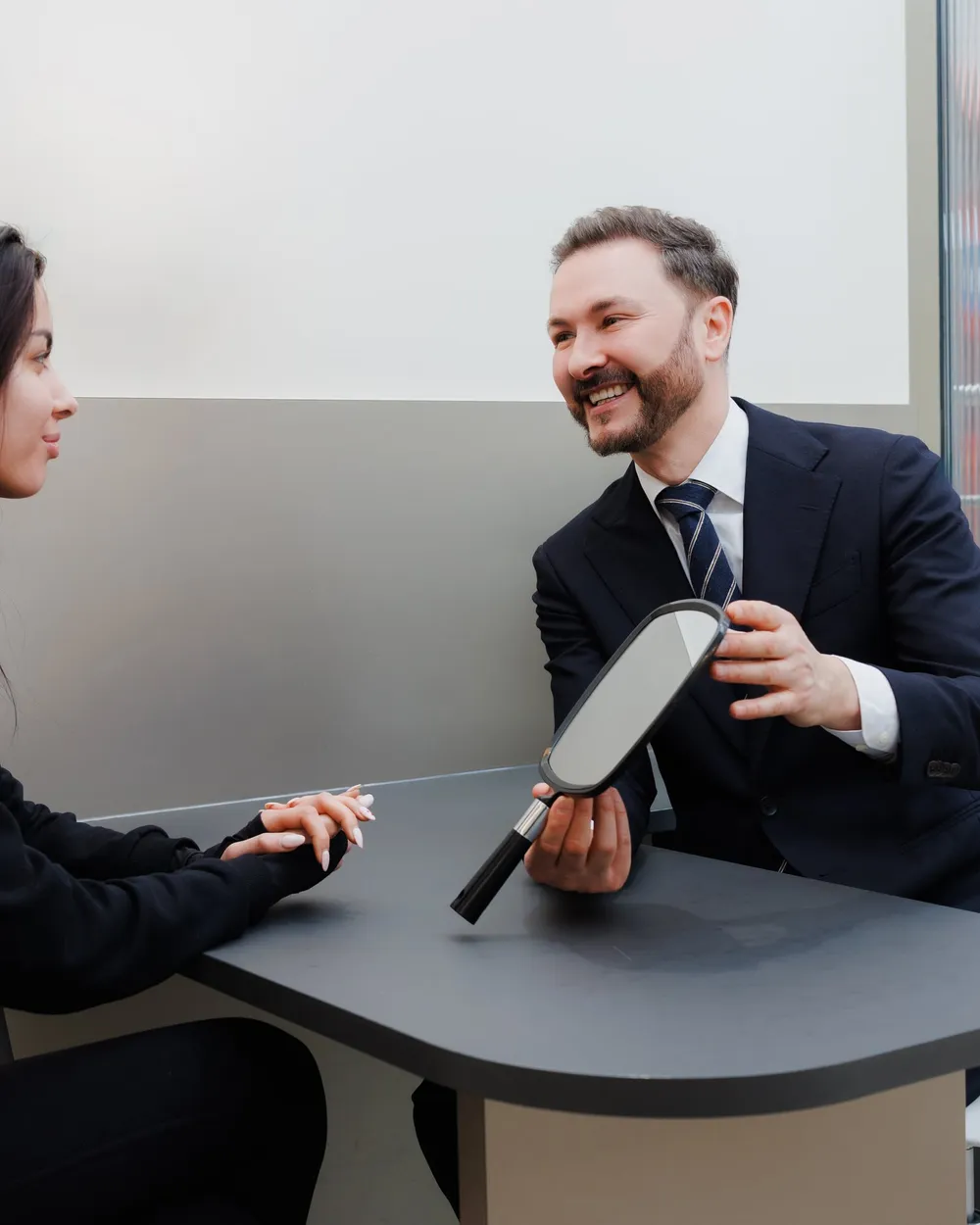 Dr Paul Elgey in consultation with a patient at his Marylebone clinic