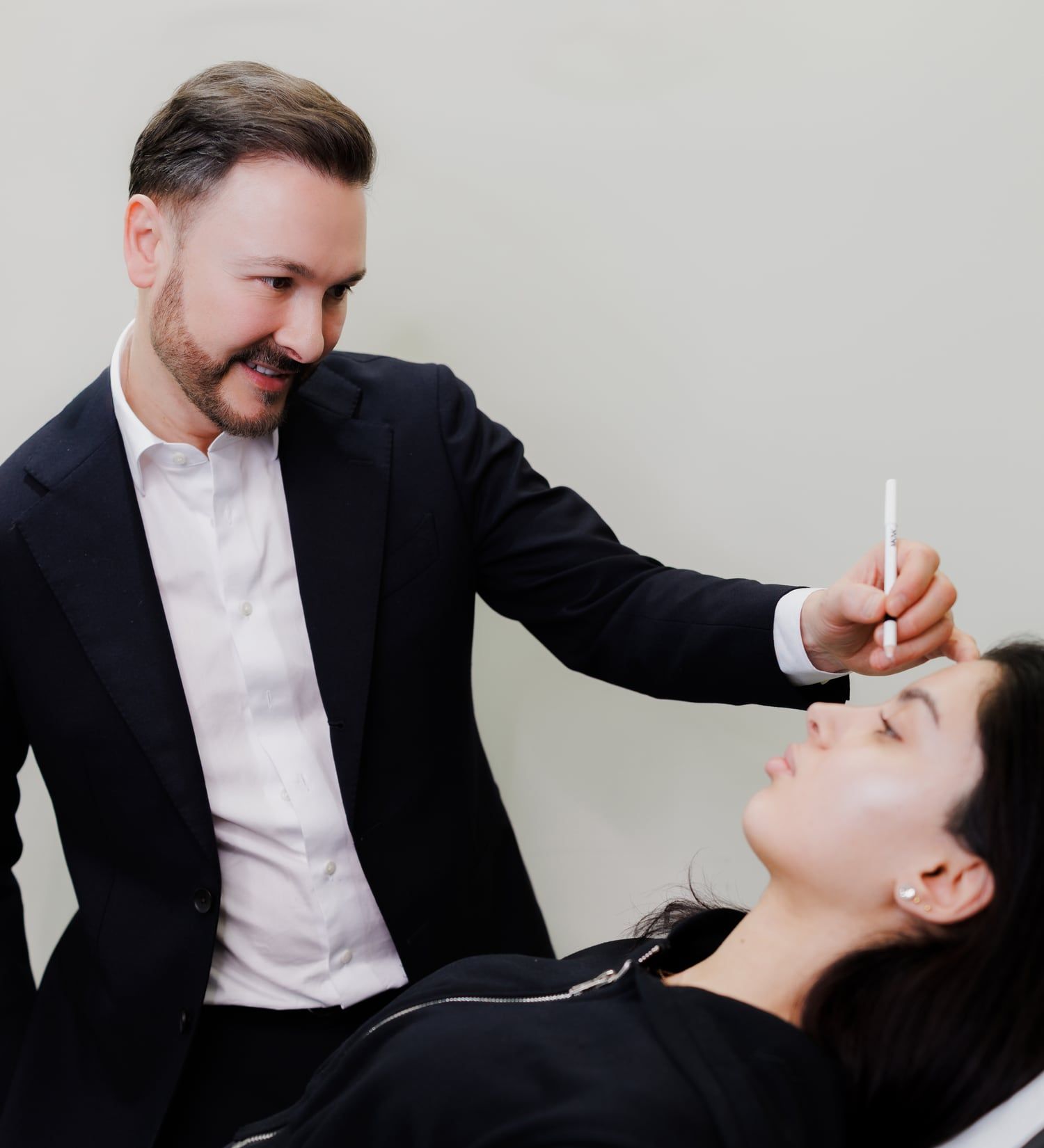 Dr Paul Elgey treating a patient at his Marylebone clinic
