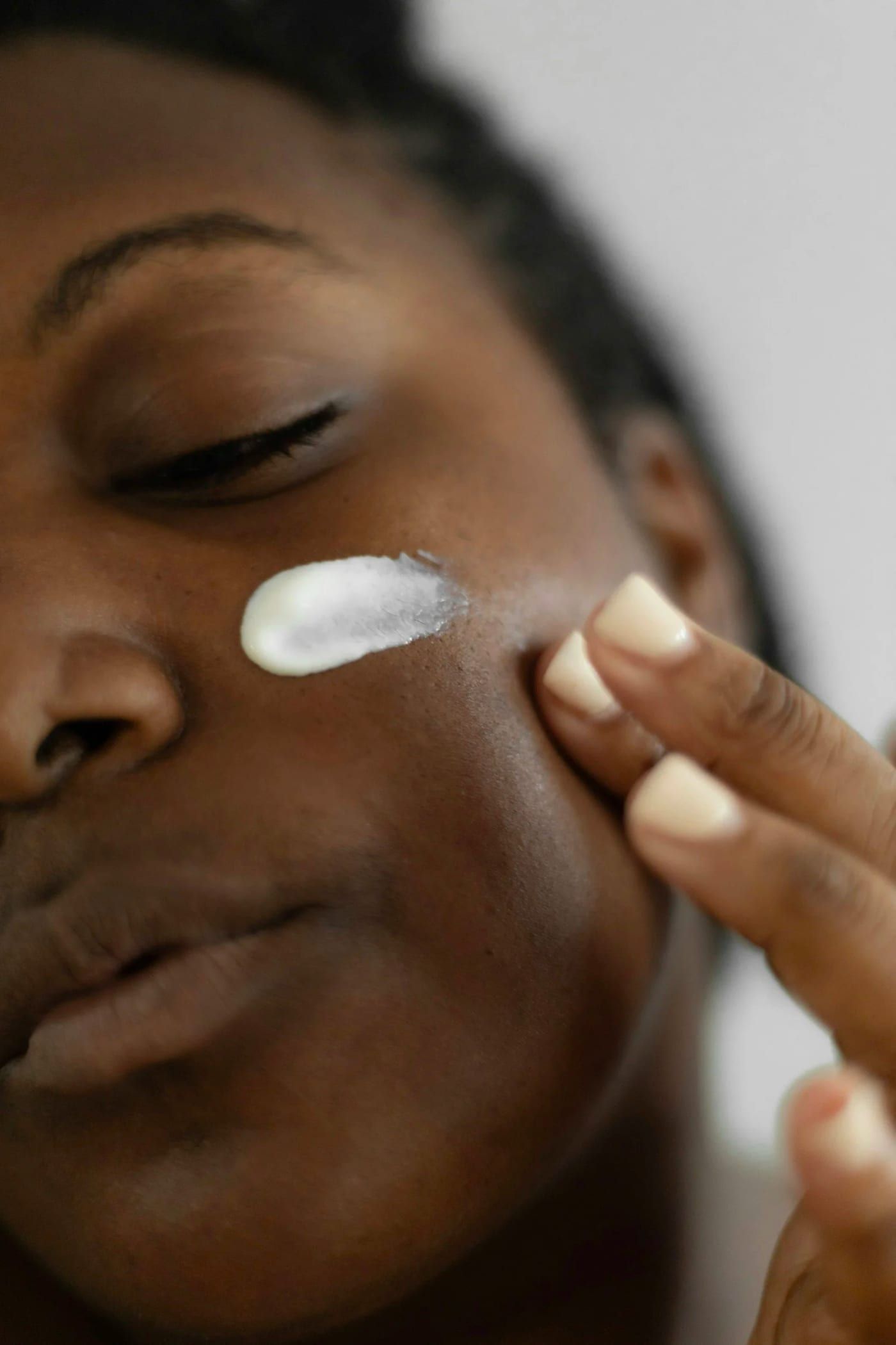 Treatment being applied to the skin of a cheek