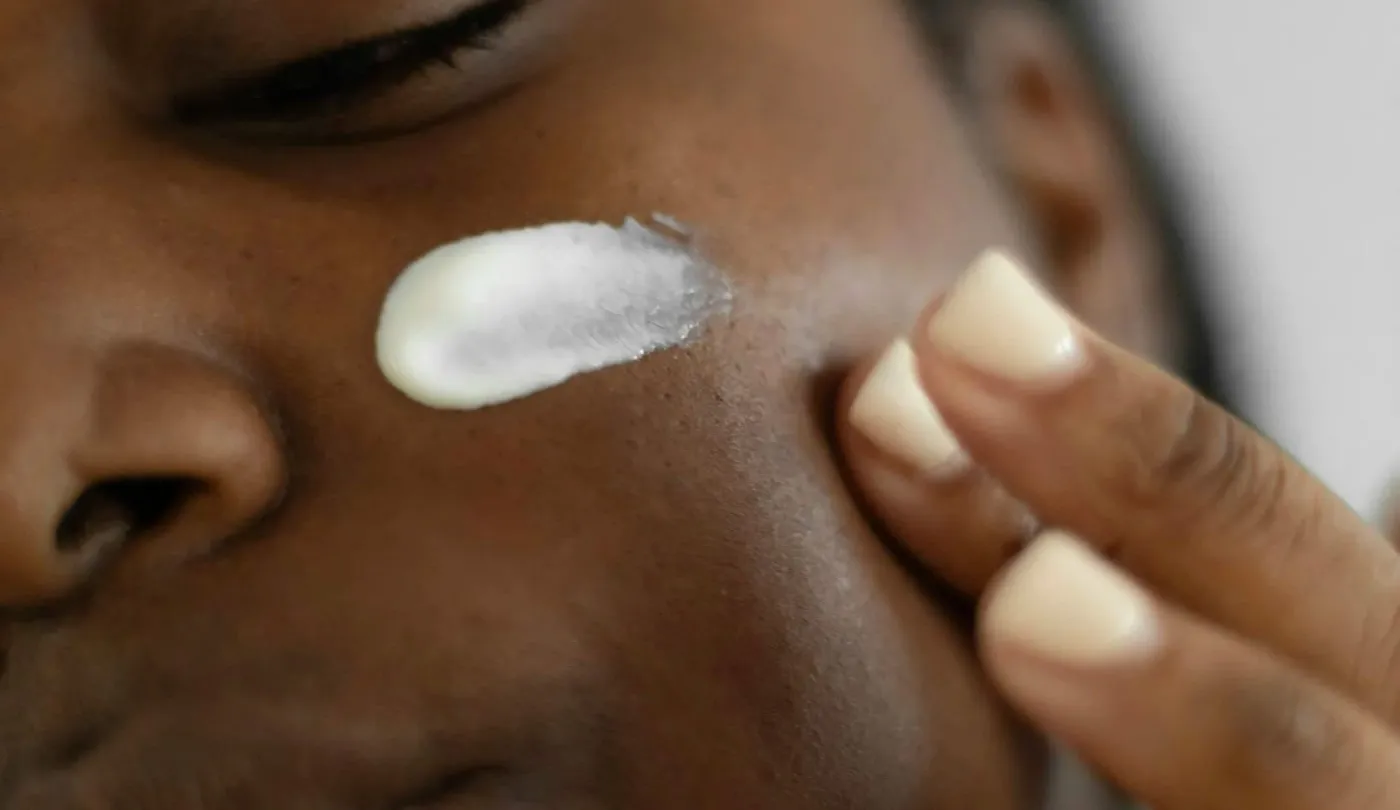 Treatment being applied to the skin of a cheek