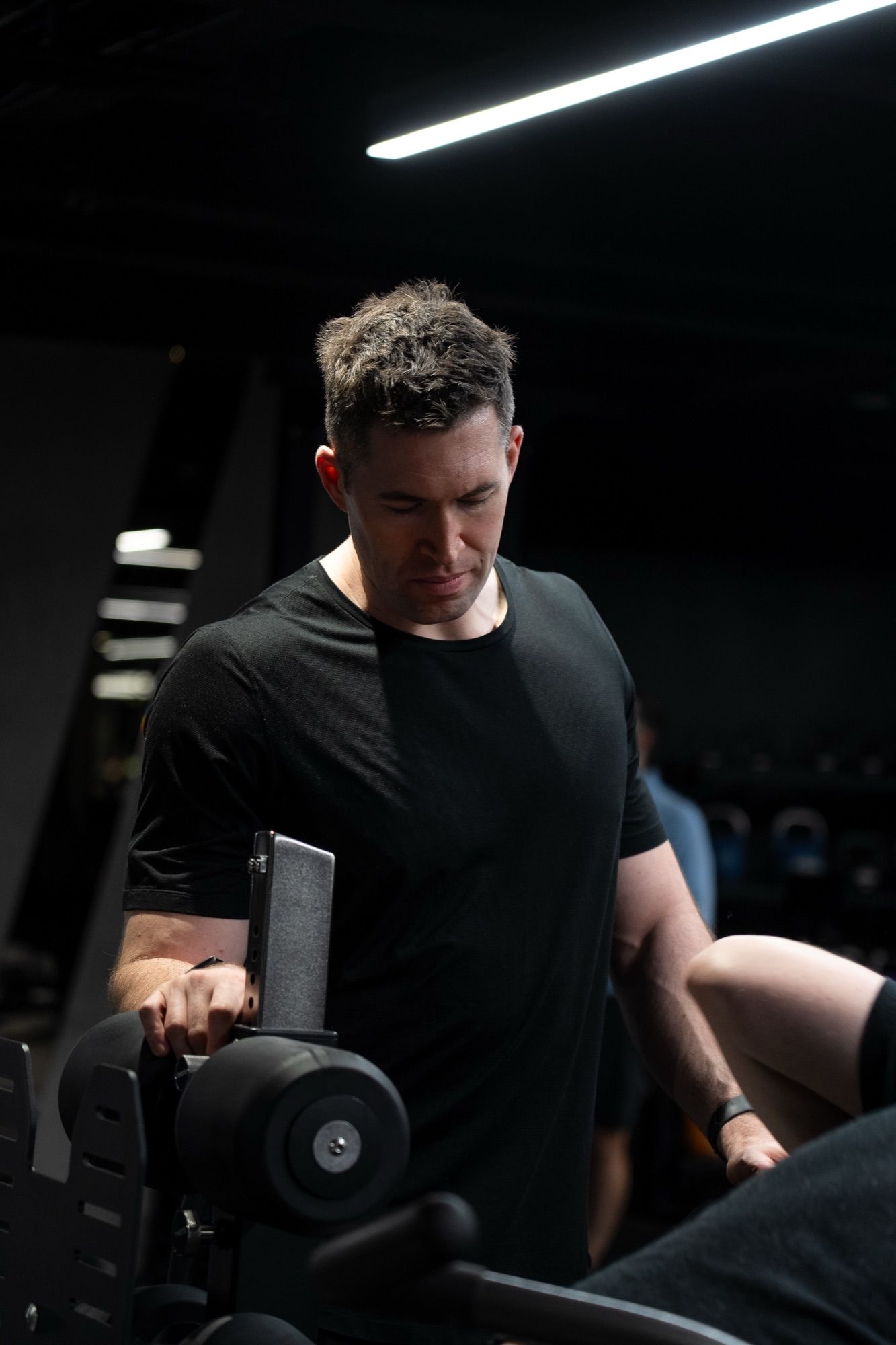 Jasper MacDermot coaching a client through a movement at UNTIL Liverpool Street