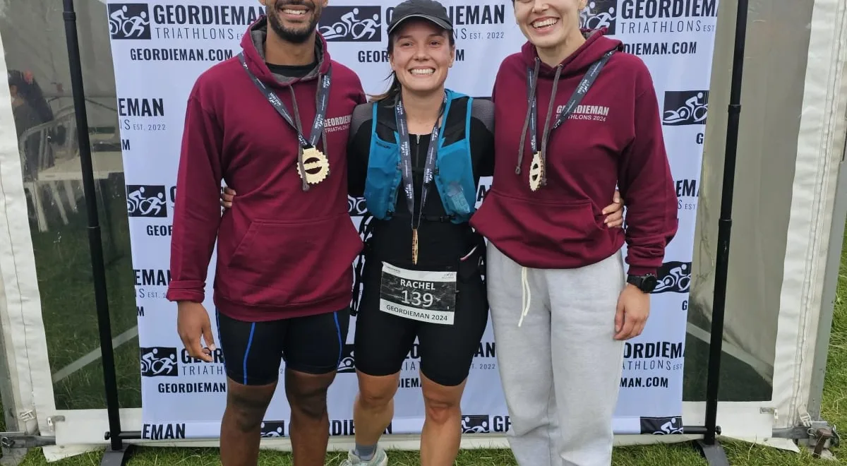 Three finishers with medals at the Geordieman triathlon