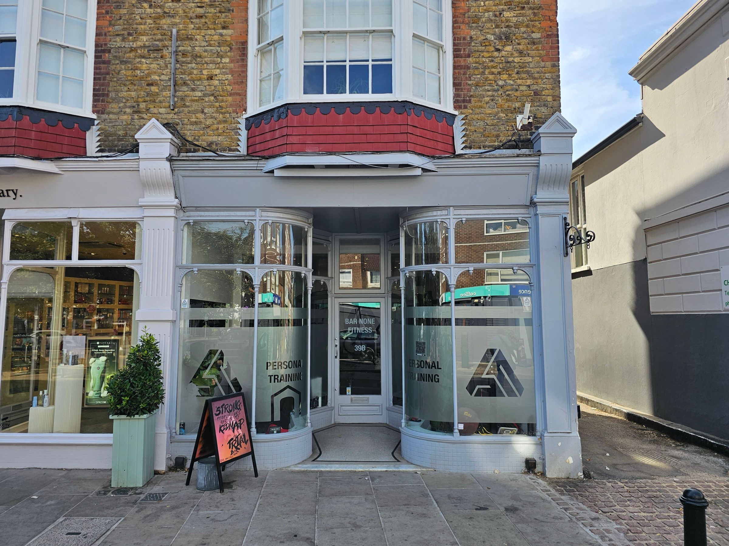 The entrance to Bar None Fitness at 39B High Street Wimbledon, where Kaizen Physiotherapy & Performance runs its Wimbledon Village clinic