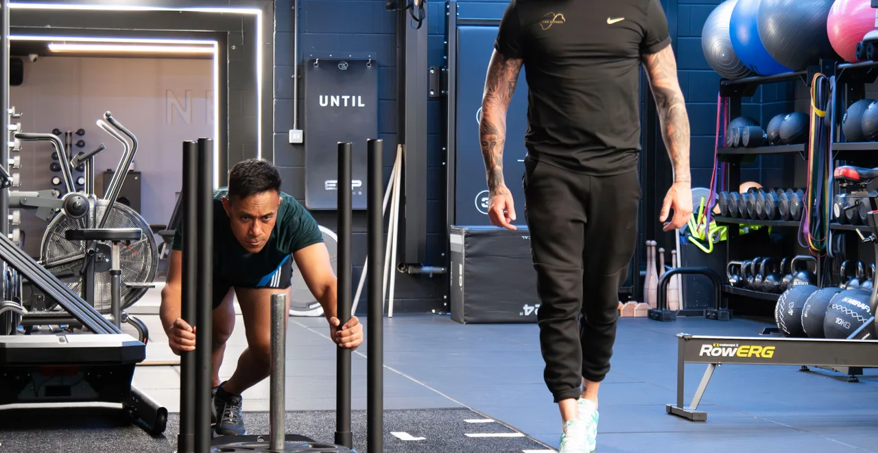 Dumbbells and a sled in the gym: strength training that protects muscle while losing weight on a GLP-1 after 40