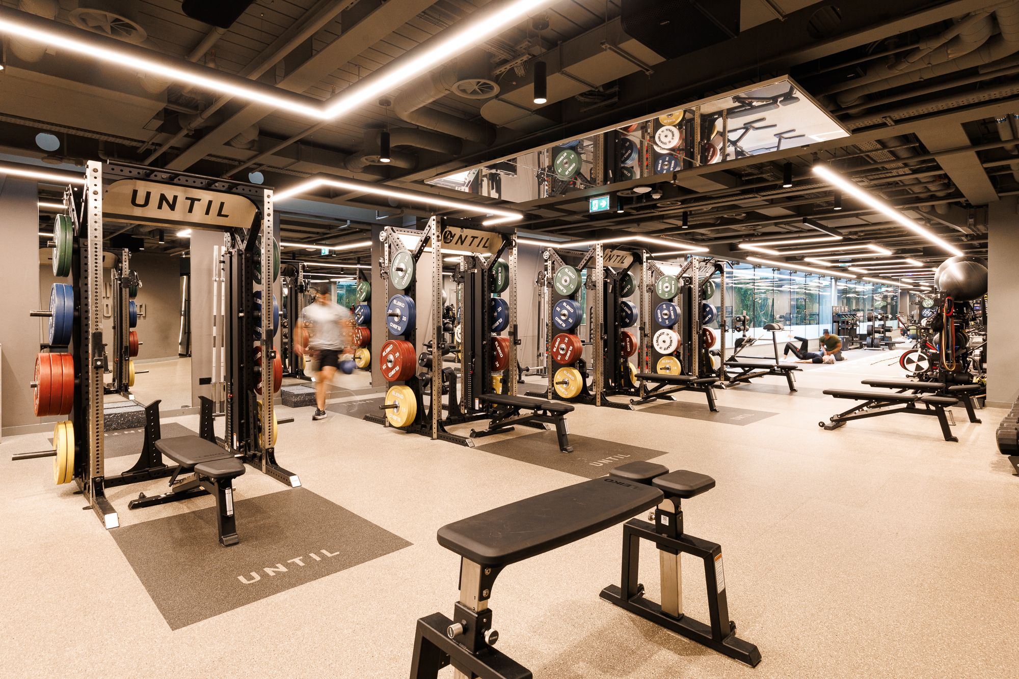 Lifting racks on the gym floor at UNTIL Marylebone, 1 Orchard Street