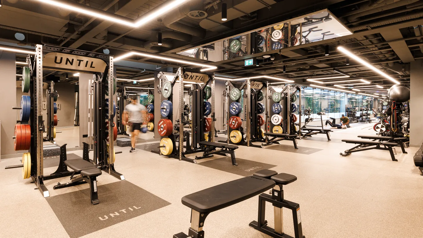 Lifting racks on the gym floor at UNTIL Marylebone, 1 Orchard Street