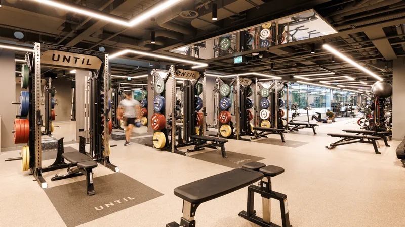 Lifting racks on the gym floor at UNTIL Marylebone, 1 Orchard Street