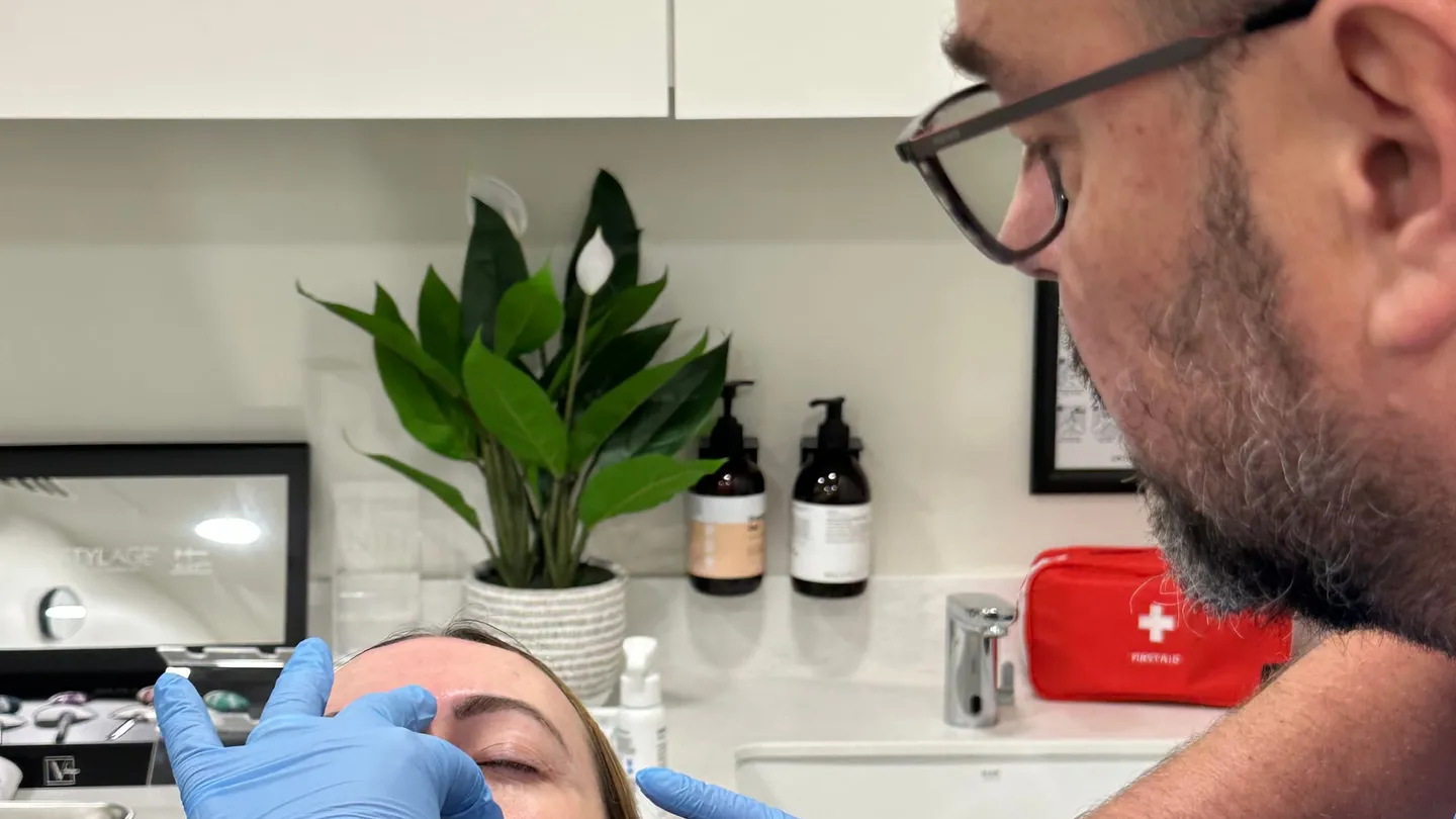 Aesthetic Nurse Practitioner performing a lip filler treatment at Perfectus Derma Aesthetics, UNTIL Soho