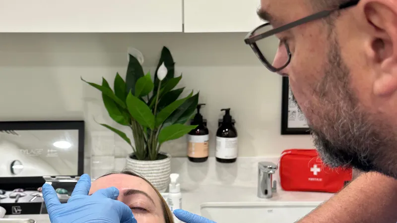 Aesthetic Nurse Practitioner performing a lip filler treatment at Perfectus Derma Aesthetics, UNTIL Soho