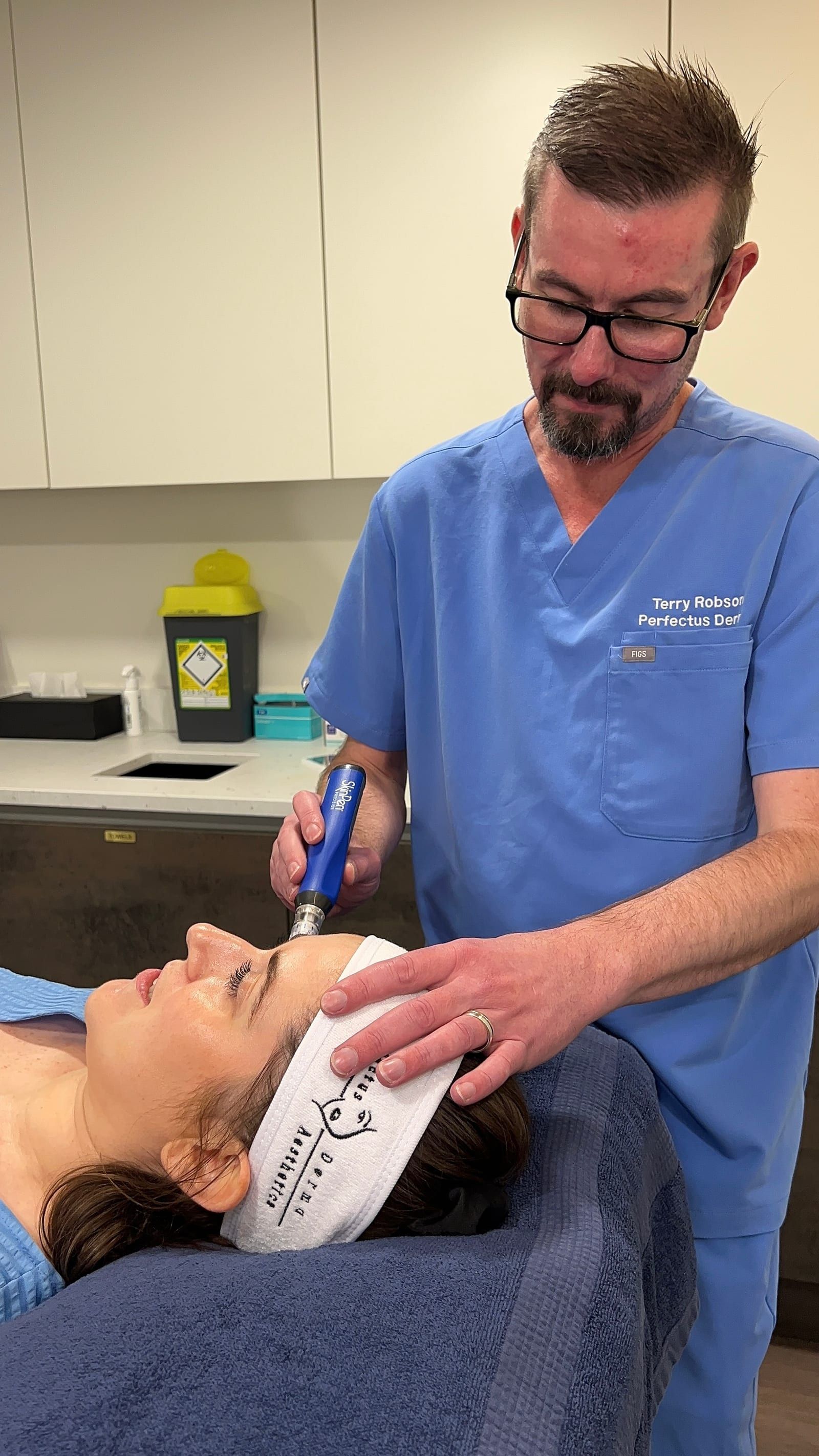 Aesthetic Nurse Practitioner preparing a SkinPen Precision microneedling treatment at Perfectus Derma Aesthetics, UNTIL Soho