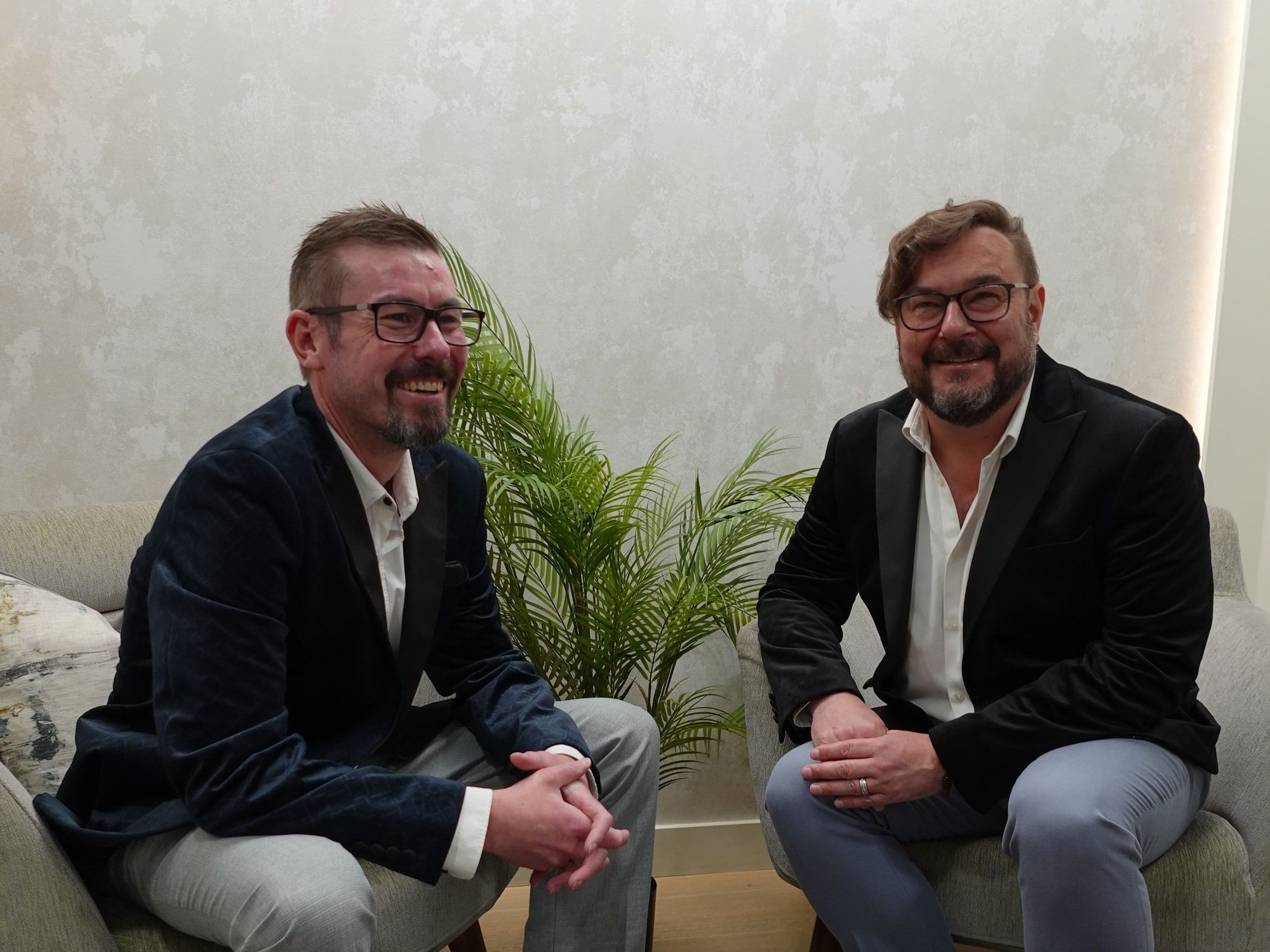 Arek and Terry seated at Perfectus Derma Aesthetics, UNTIL Soho
