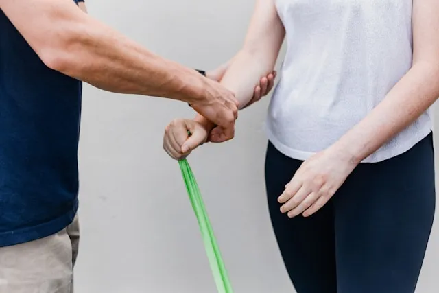 Physiotherapist assessing and treating a patient during a sports rehabilitation session at Physio and Performance in Soho, London