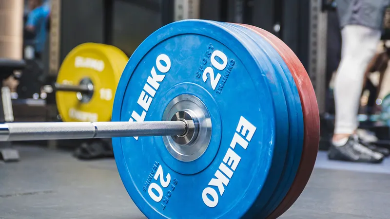 A physiotherapist coaching a one-to-one strength training session at Physio and Performance in Soho, London