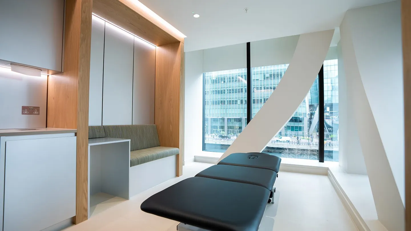 Treatment room at UNTIL Canary Wharf: a clinical plinth set up for assessment and hands-on treatment.