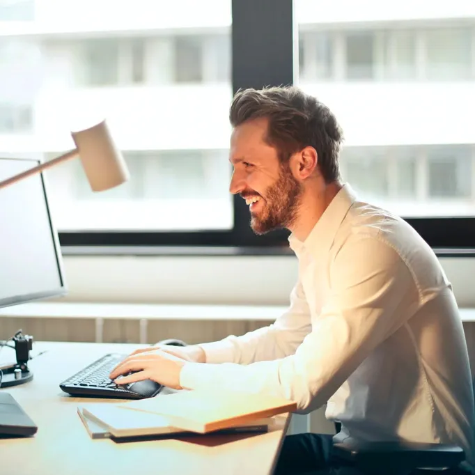 Physiotherapist conducting a workplace ergonomic assessment in central London