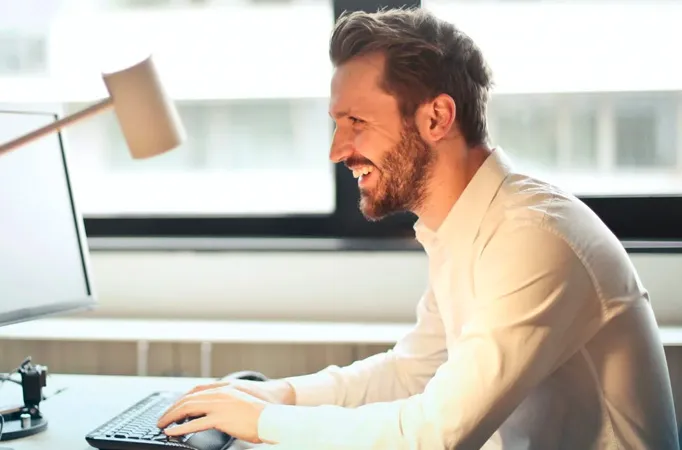 Physiotherapist conducting a workplace ergonomic assessment in central London