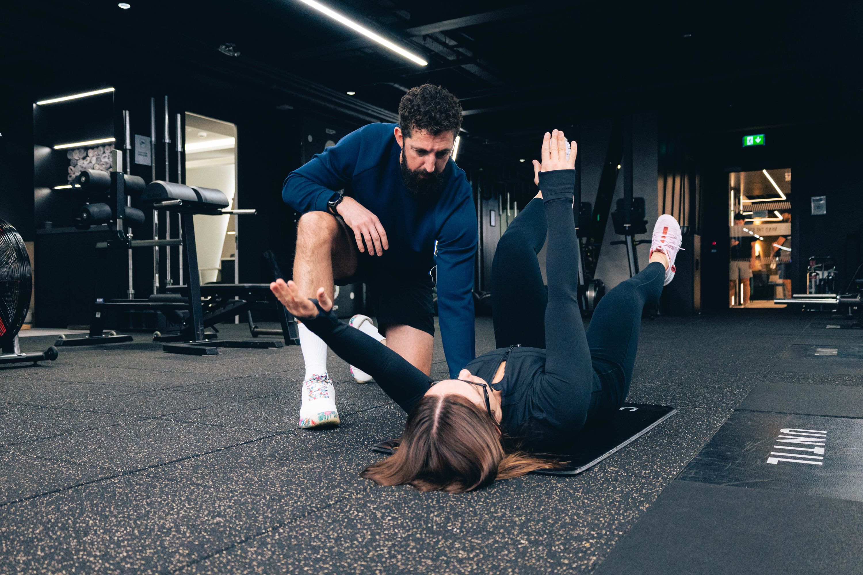 Matt Alexander coaching a client through a movement at UNTIL Liverpool Street
