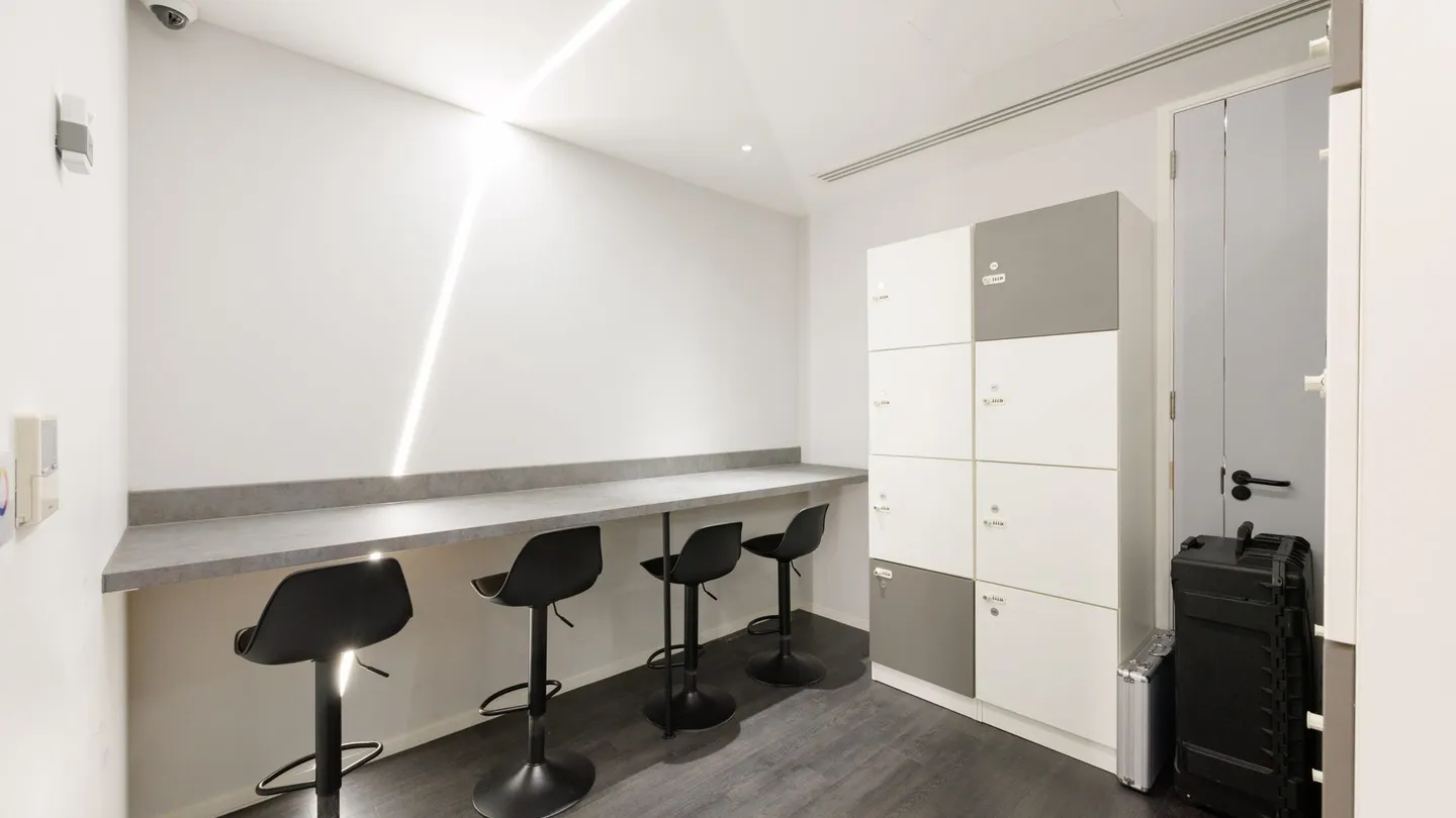 A consultation room at UNTIL, 280 Bishopsgate, with a treatment couch and a desk