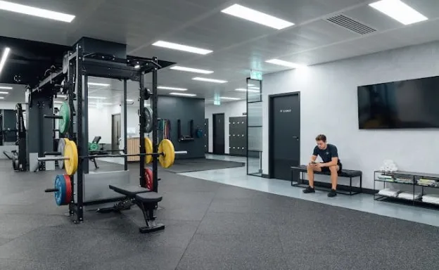 The private training studio at Common Purpose, Mayfair, with a rack, bench and screen