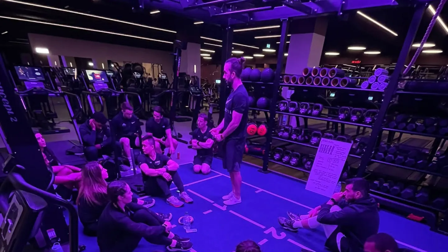 Leigh Clayton talking through health and performance data with clients at W1 Performance