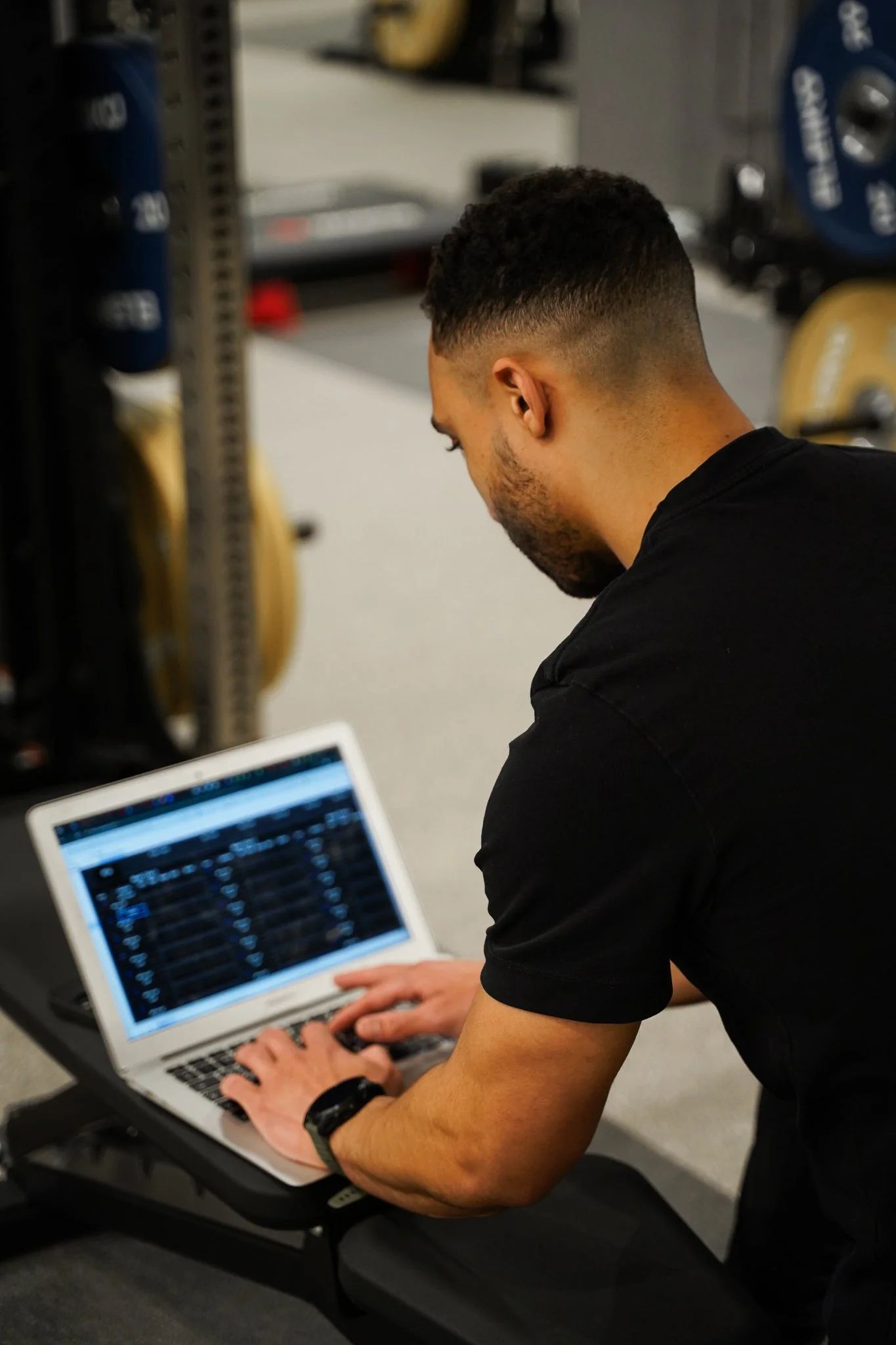 Will Agbo building a client training programme on the laptop